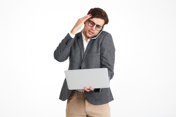 Portrait of a puzzled businessman in eyeglasses